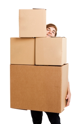 An employee peeks out from behind 4 large boxes he’s holding; 49 KB.