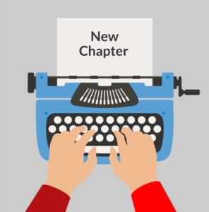 Illustration of two hands typing on a typewriter. The paper in the typewriter says “New Chapter.”