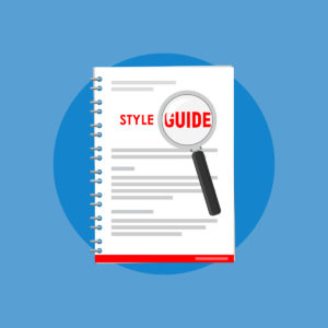 Magnifying glass magnifies the words "Style Guide" on the cover of a spiral-bound document. Illustration on a blue background.