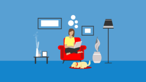 Person sitting cross-legged in an armchair working on a laptop, while a dog sleeps on a mat in front of the chair. (Copyright: emarandjelovic © 123RF.com)