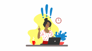 Person at a computer holding up their index finger with exclamation marks over their head, showing a new idea.