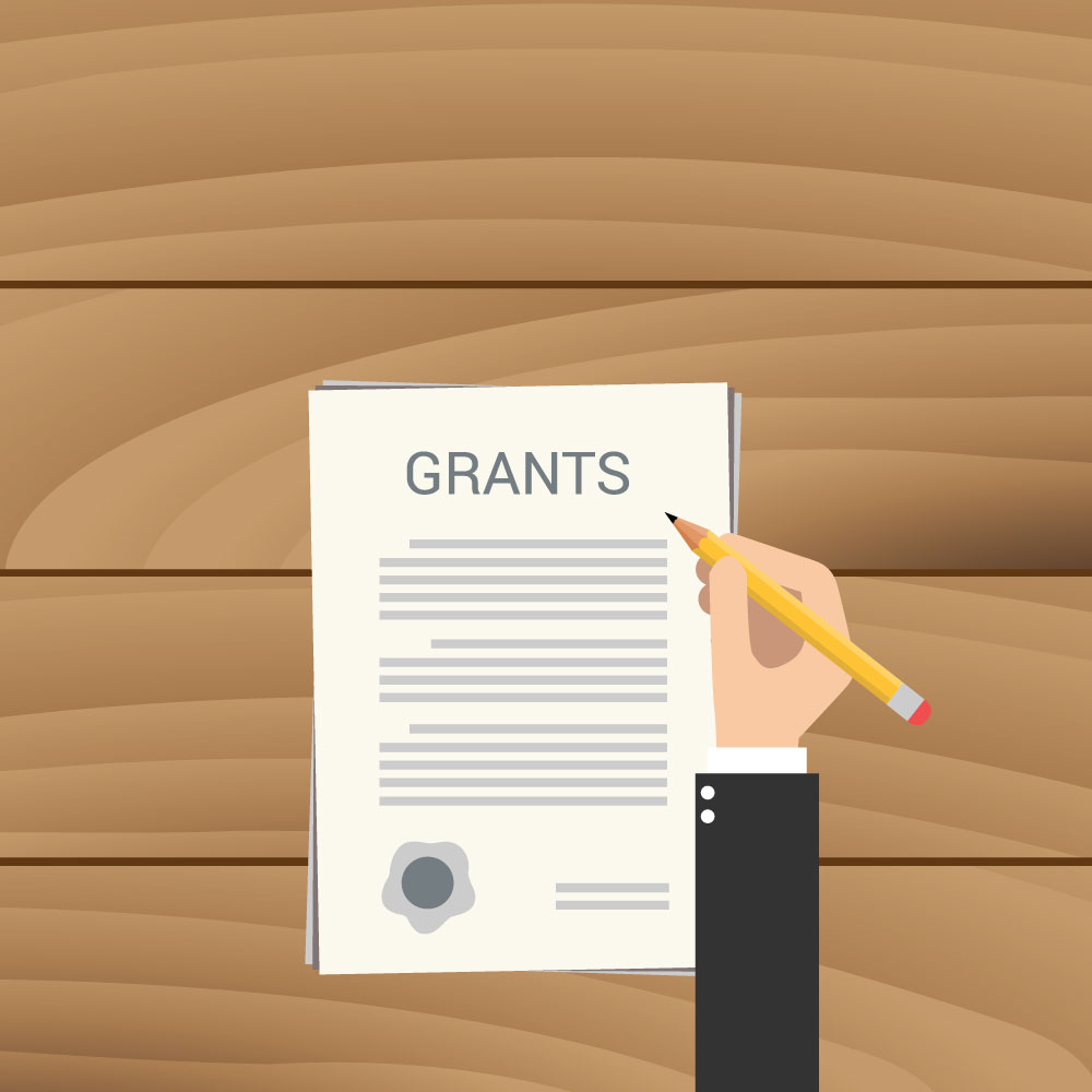 Person holding a pencil over a page titled “Grants.” (Copyright: binaryproject © 123RF.com)