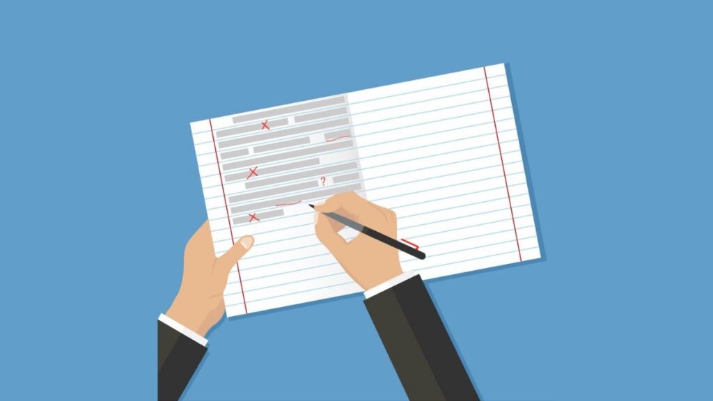 Hands over an open lined notebook, correcting text errors with a red pen. (Copyright: dvolkovkir1980 © 123RF.com)